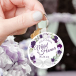 Purple & Plum Floral Wreath Maid of Honor Wedding Schlüsselanhänger<br><div class="desc">This keychain is designed as a thank you gift for the Maid of Honor at your wedding. The elegant boho chic design a rustic hand painted watercolor design with a wreath of roses and flowers in shades of purple, violet, plum, and lavender. The text is written in elegant script letters,...</div>