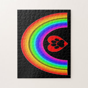 Puzzle Herz mit Pfote unter einem Regenbogen