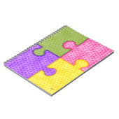 Puzzlespiel bessert helles Notizbuch aus Notizblock (Linke Seite)