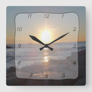 Quadratische Uhr mit Ozean-Sonnenuntergang u.