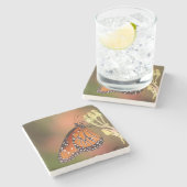 Queen-Schmetterling auf einem Ast Steinuntersetzer (Seitenansicht)