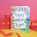 Rainbow Blume Pinselschrift zum Geburtstag Karte<br><div class="desc">Rainbow farbene Happy Geburtstagskarte mit einem Rahmen von Blume in Rot,  Orange,  Gelb,  Grün,  Blau und lila mit einem fröhlichen Geburtstag für Sie geschrieben in einem bezaubernden blauen Pinselskript.</div>
