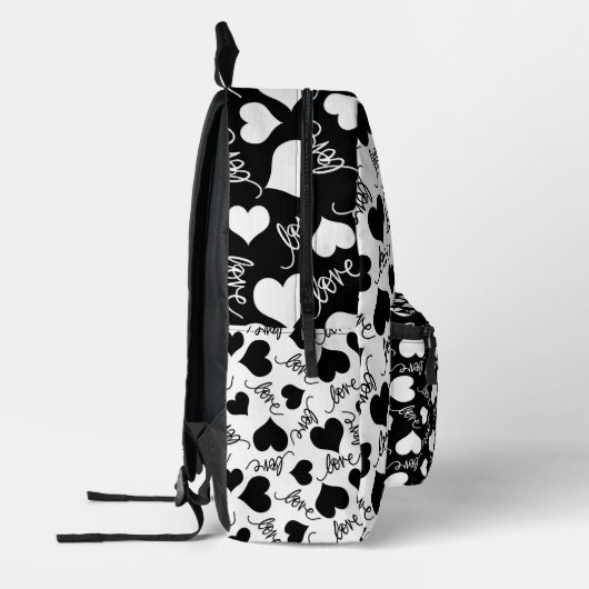 RANDOM-SCHWARZE UND WEISSE HERZEN MIT LIEBE-SKRIPT BEDRUCKTER RUCKSACK (Links)