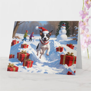 Rat Terrier läuft im Schnee mit Weihnachtshut Karte
