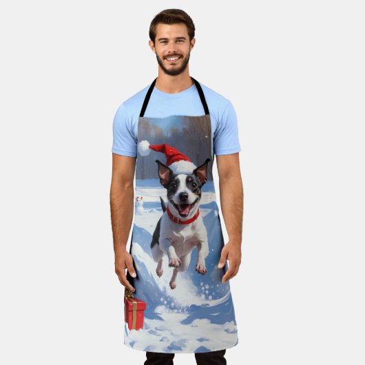 Rat Terrier läuft im Schnee mit Weihnachtshut Schürze (Getragen)