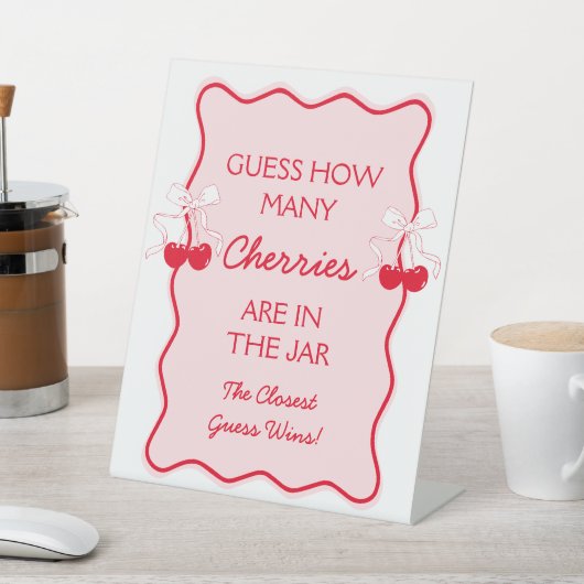 Raten Sie mal, wie viele Kirschen oben kreischen Sockelschild (In SItu)