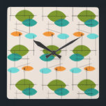 Re-atomar-Muster-Wand-Uhr Quadratische Wanduhr<br><div class="desc">Diese neue Atomic Mobile Pattern Square Wall Uhr ist im modernen Stil der Mitte des Jahrhunderts in ihrer besten Form. Das Vintag inspirierte Design ist cremefarben mit spitzen Ovalen in Türkis, Orange, aquamarin und Avocado grün. Die aquamarinen und Avocado grünen Ovale überlappen sich und schaffen einen schönen Schatten Pfauenblau. Spaß...</div>