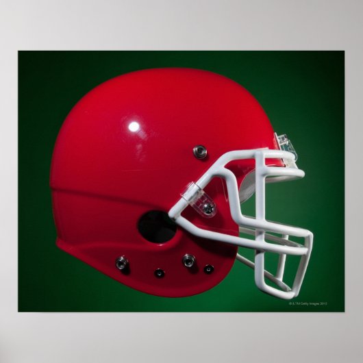 Red American football helmet on green background Poster (Vorne)