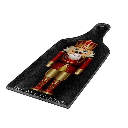 Red and Gold Nutcracker auf Black Schneidebrett (Ecke)