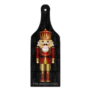 Red and Gold Nutcracker auf Black Schneidebrett