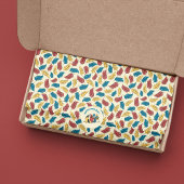 Red, Blue and Yellow Cartoon Feathers on Cream Seidenpapier