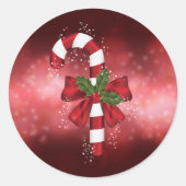 Red Candy Cane auf einem roten Bokeh Hintergrund Runder Aufkleber (Vorderseite)