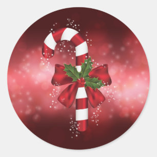 Red Candy Cane auf einem roten Bokeh Hintergrund Runder Aufkleber