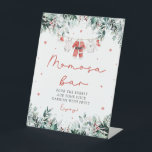 Red Christmas Santa Baby Kleidung Momosa Bar Sign Sockelschild<br><div class="desc">Das Red Santa Gender Neutral Santa Baby Kleidung Weihnachten Momosa Bar Sign bringt einen ansprechenden und festlichen Charme in Ihre Babydusche Getränkestation! Mit seinem fröhlichen roten Design mit zarten Schneeflocken, Eukalyptusgrün und bezaubernden, vom Weihnachtsmann inspiriert Babykleidung schafft dieses Schild die perfekte Mama-Osa-Bar. Es lädt die Gäste herzlich ein, die Blase...</div>