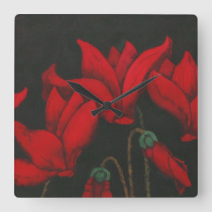 Red Cyclamen blossom on dark black background Quadratische Wanduhr