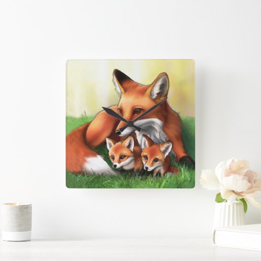 Red Fox Mutter und Kits im Gras Quadratische Wanduhr (Zuhause)