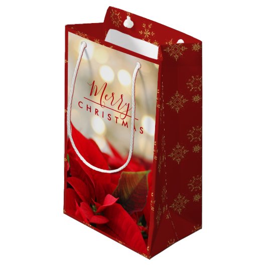 Red Poinsettias mit Golden Bokeh Weihnachten Kleine Geschenktüte (Vorderseite Schrägansicht)