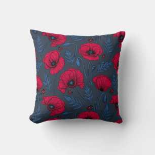 Red poppies and ladybugs on dark blue kissen