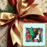RedGreen Christmas Solstice Fairy Quadratischer Aufkleber<br><div class="desc">Eine schwarzhaarige Fee mit roten und grünen Feenflügeln. Schneeflocken,  rote Poinsettien und blaue Schmetterlinge rund um sie</div>