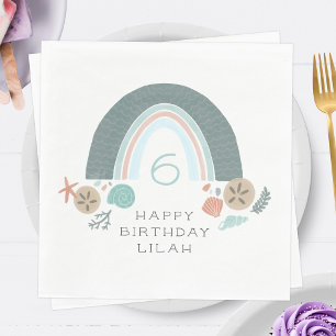 Regenbogen-Seashell unter dem Party Serviette