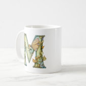 Regenbogenfee Anfangsbuchstabe 'M' Kaffeetasse (Vorderseite Links)