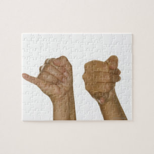 Reihe Hände, die J-Zeichen machen Puzzle