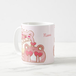 Reizende Frösche teilen einen Kuchen Kaffeetasse