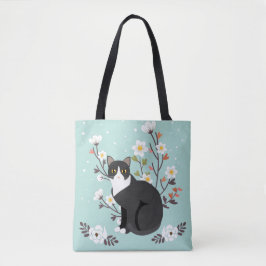 Reizende Tuxedo-Katze in den Blumen ganz vorbei - Tasche