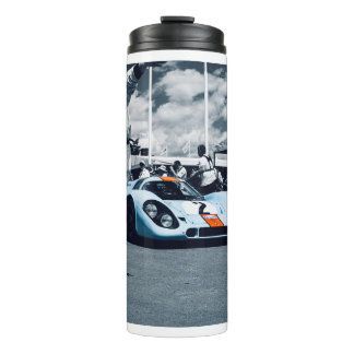 Rennwagen in Blau und Orange Thermosbecher