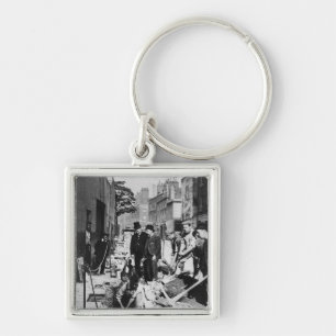 Reparieren eines Rohres Schlüsselanhänger