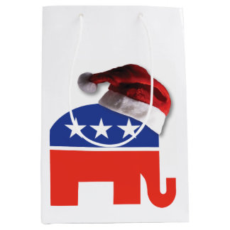 Republikanischer Elefant, der einen Weihnachtsratt Mittlere Geschenktüte