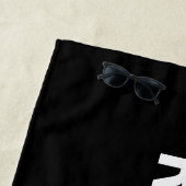 RESERVIERT, weißer Text auf schwarzem Badetuch (Beispiel)