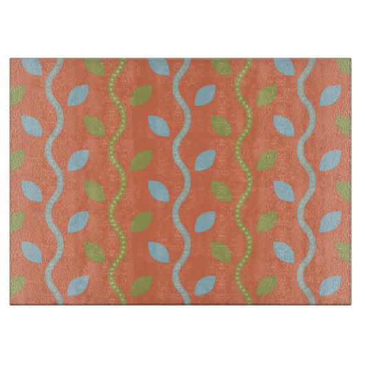 Retro Blue & Green Vines auf orangefarbenem Muster Schneidebrett (Vorderseite)