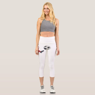 Retro-Fußballspieler, der einen Ballvolley kickt Capri Leggings