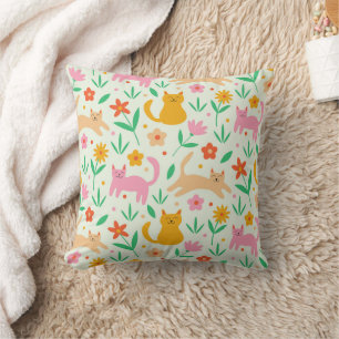 Retro-glückliche Katzen mit orange-roten und pfirs Kissen