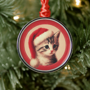 Retro-Illustration eines Kätzchens mit Weihnachtsm Ornament Aus Metall