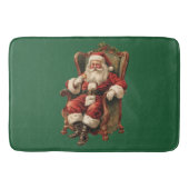 Retro Santa Claus sitzt in einem Stuhl Weihnachten Badematte (Vorderseite)