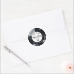 Retro Vinyl Record Black and White Music Wedding Runder Aufkleber<br><div class="desc">Dieses einzigartige Retro Schwarz-Weiß Vinyl Record Musik Thema Hochzeitsempfang rund Form Aufkleber-Set mit einem einprägsamen Titel Zitat "This Is One For The Record" Namen und Hochzeitsdatum wird ein unvergesslicher "Hit" als Einladung Umschlag Gehäuse, Kuchen picks, oder Bevorzugen Aufkleber! Passend zur runden Vinyl-Schallplattenform oder Bogen-Acryl-Hochzeitskunde. Personalisieren Sie die Formulierung einfach und...</div>