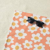 Retrostil blüht auf orangefarbenem Hintergrund Strandtuch (Beispiel)
