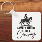 Rettet einen Pferdereiten auf einem Cowboy Schlüsselanhänger (Vorderseite)
