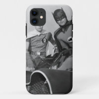 Robin and Batman Standing in Batmobile