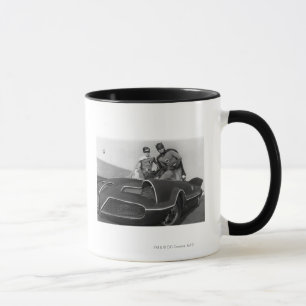 Robin and Batman Standing in Batmobile Tasse