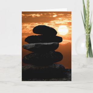 rock cairn with sunset sky karte