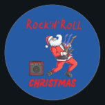 Rock-N-Roll Christmas Runder Aufkleber<br><div class="desc">Santa jamming auf der Gitarre und spielen durch einen Verstärker. Rock'n'Roll Weihnachten. Mit diesem Rockin-Design verbringen Sie Ihren Urlaub.</div>