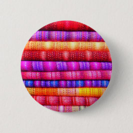 Rollen von farbenfrohen Stoffen Button