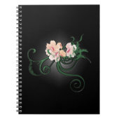 Rosa Blume blüht auf schwarzem Hintergrund Notizblock (Vorderseite)