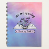 Rosa Blumen, die aus Buch wachsen Planer (Vorderseite)