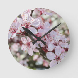 Rosa Blüten roten Stiele. Runde Wanduhr