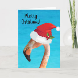 Rosa Flamingo in einer roten Weihnachtsmannmütze W Feiertagskarte