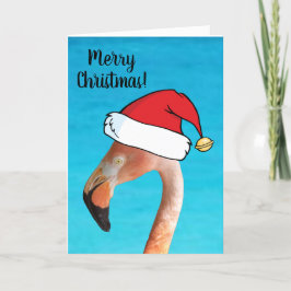 Rosa Flamingo in rotem Cartoon Weihnachtsmannmütze Feiertagskarte